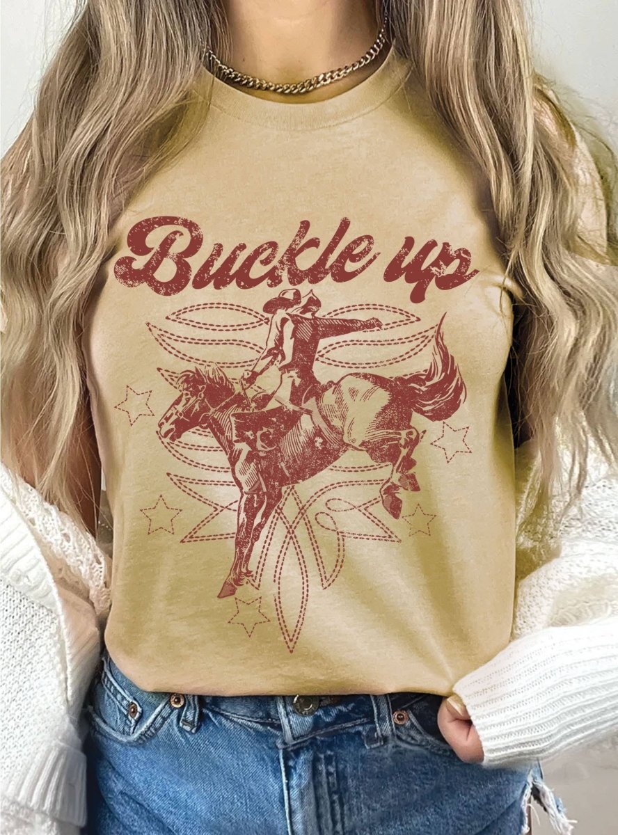 Rustee ClothingBUCKLE UP COWBOY BOOTS STITCH PATTERN GRAPHIC TEEBravo Bra Boutique