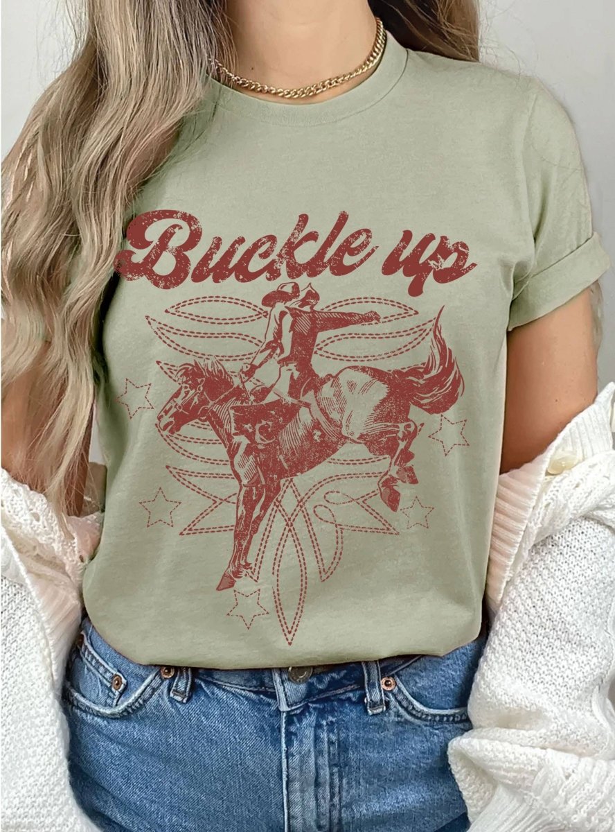Rustee ClothingBUCKLE UP COWBOY BOOTS STITCH PATTERN GRAPHIC TEEBravo Bra Boutique